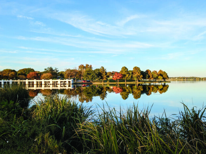 Cyclist captures calm winds, fair lake